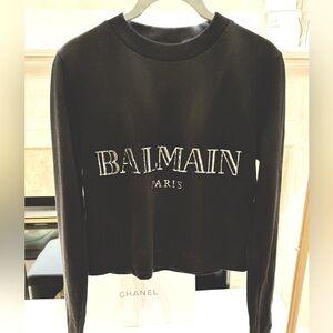 Balmain cropped sweater in black with silver in size 38.